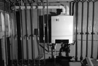 Wall-mounted boiler with piping during new construction