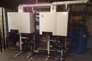 Dual wall-mounted boiler installation for commercial building